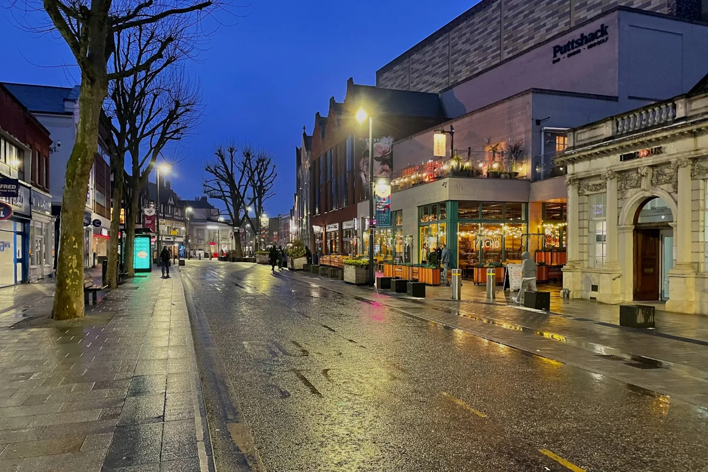 Watford High Street at dusk. The borough's claimant rate, 4.5 per cent of working-age residents, is the highest of Hertfordshire's ten districts and the fifth highest of 45 local authorities in the East of England