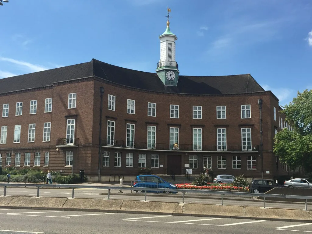 Watford Town Hall, the home of Watford Borough Council. The council has been told to stop preparing for its own abolition while the government reviews the decision